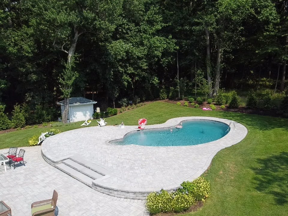 Aerial view of residential pool and patio inspected by Aquatic Pool Inspections